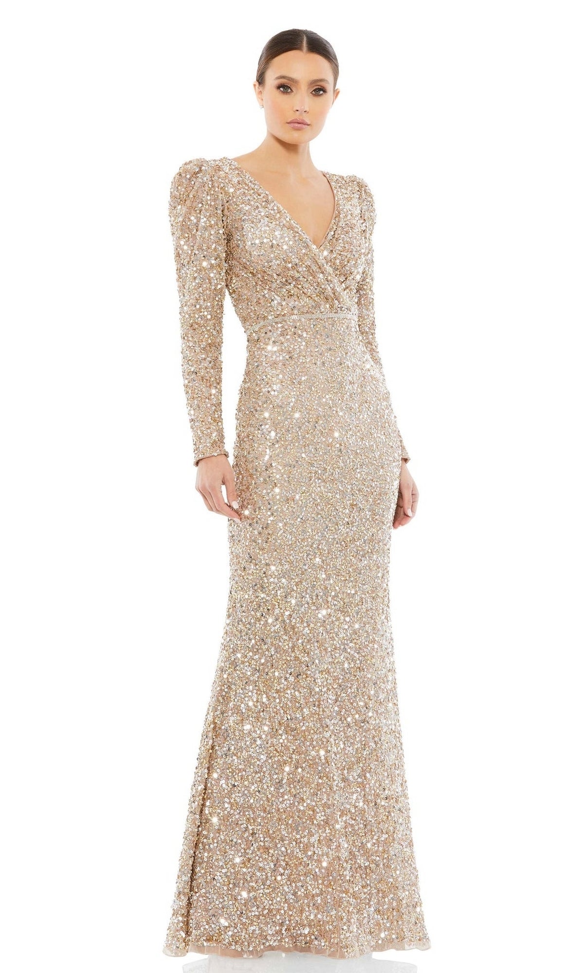A woman wears the Mac Duggal 5510 Long Sleeve Sequin Formal Dress, featuring a v-neckline and fitted silhouette, standing against a plain white background.